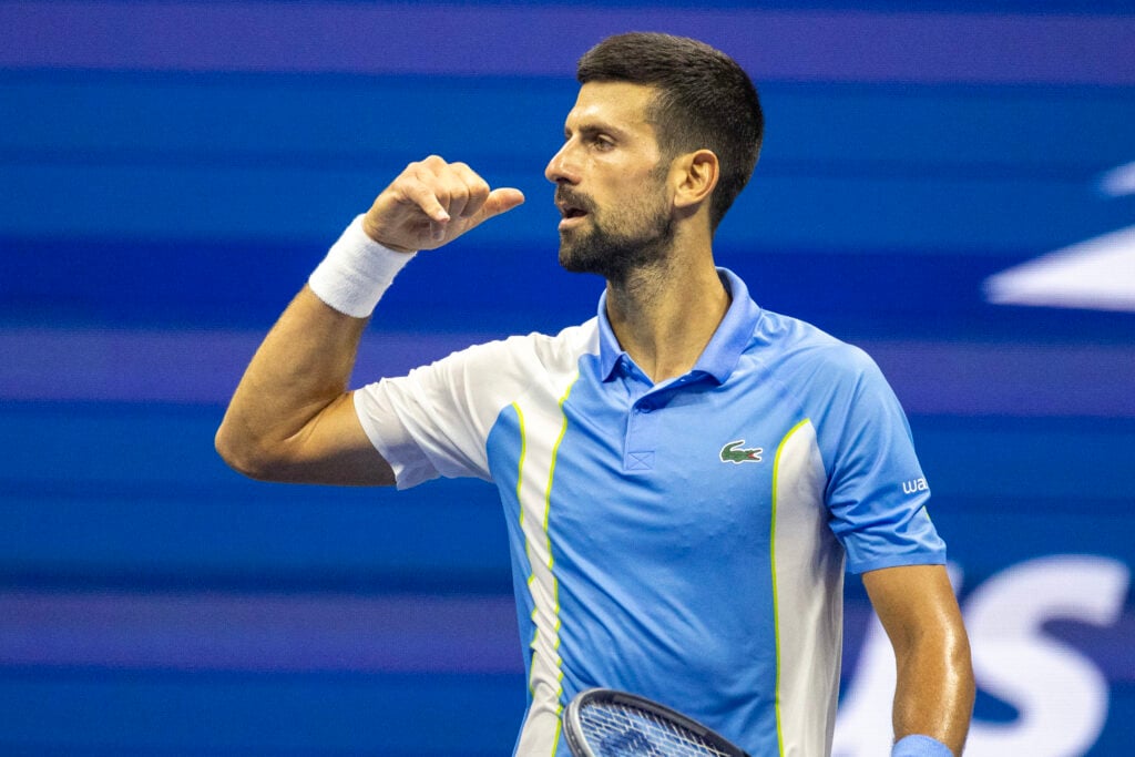 Novak Djokovic celebrating after defeating Ben Shelton at the 2023 US Open.