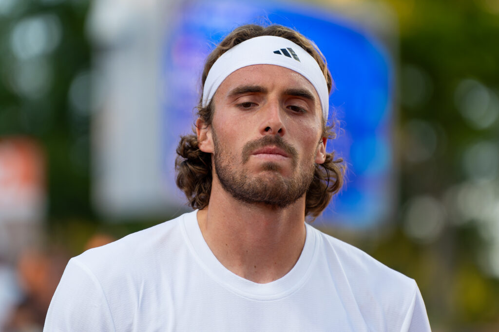 Stefanos Tsitsipas of Greece looks dejected after competing in the Men's Doubles during Day 2 of Tennis - Olympic Games Paris 2024 at Roland Garros.