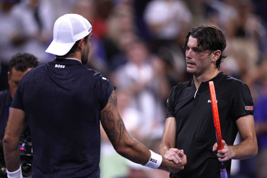 Taylor Fritz of the United States shakes hands with Matteo Berrettini of Italy after winning their Men's Singles Second Round match on Day Three of the 2024 US Open at USTA Billie Jean King National Tennis Center.