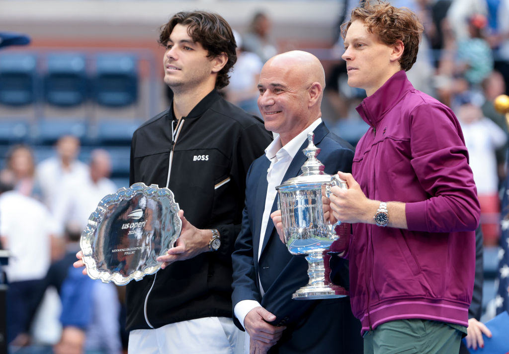 Taylor Fritz and Jannik Sinner pose during the 2024 US Open trophy ceremony.