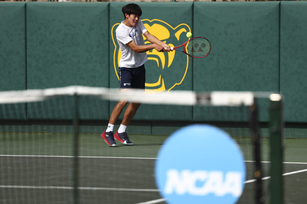 Michael Zheng hits a backhand during the 2024 Division I Men's Tennis Championship