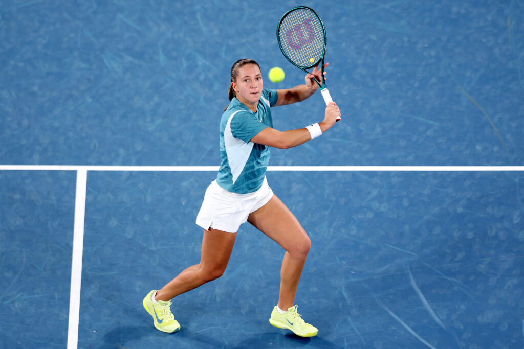 Diane Parry prepares to hit a high backhand volley a the 2025 Australian Open