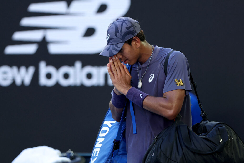 Thailand's Kasidit Samrej exits the court after his loss to Russia's Daniil Medvedev in the men's singles match on day three of the Australian Open in Melbourne.