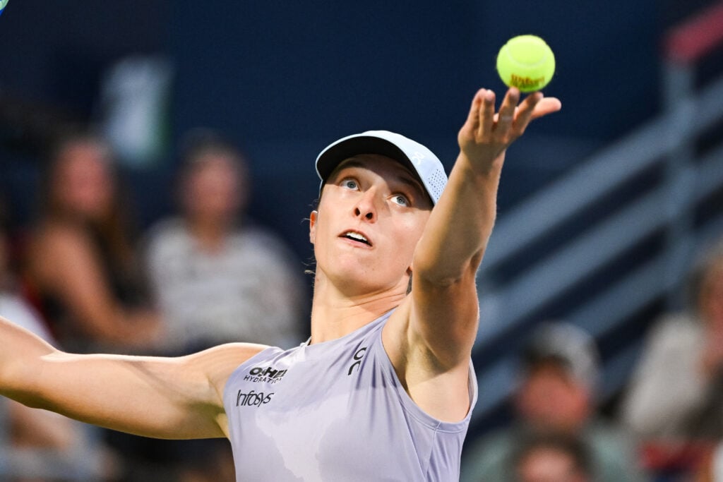 Iga Swiatek serves the ball during a third round match at WTA National Bank Open at IGA Stadium.