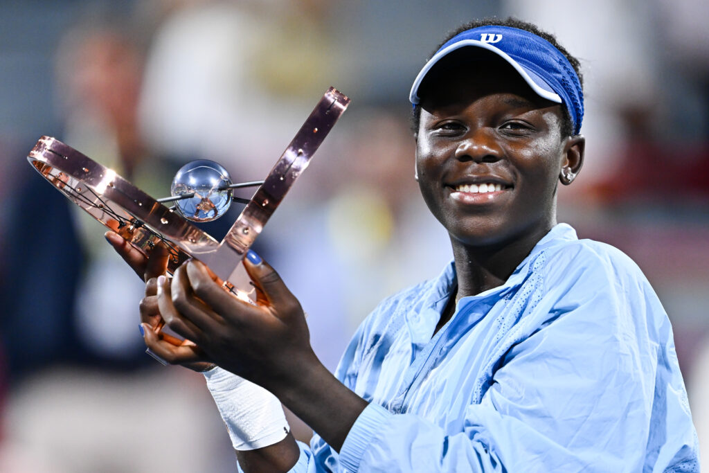 Victoria Mboko celebrates with the Canadian Open title after beating Naomi Osaka in the final