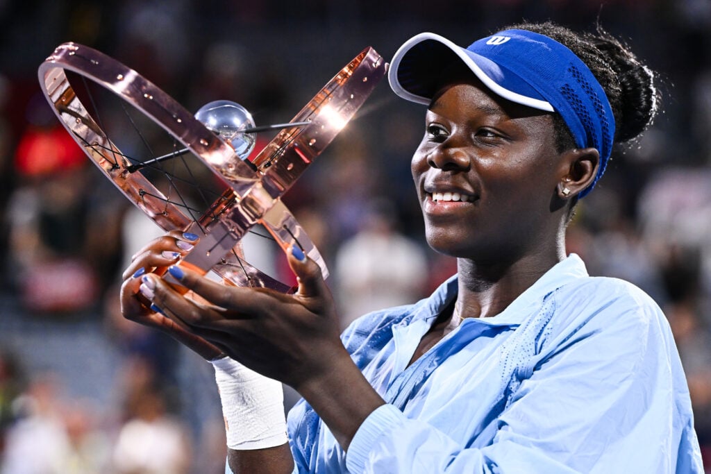 Victoria Mboko poses with the trophy after winning the 2025 Canadian Open