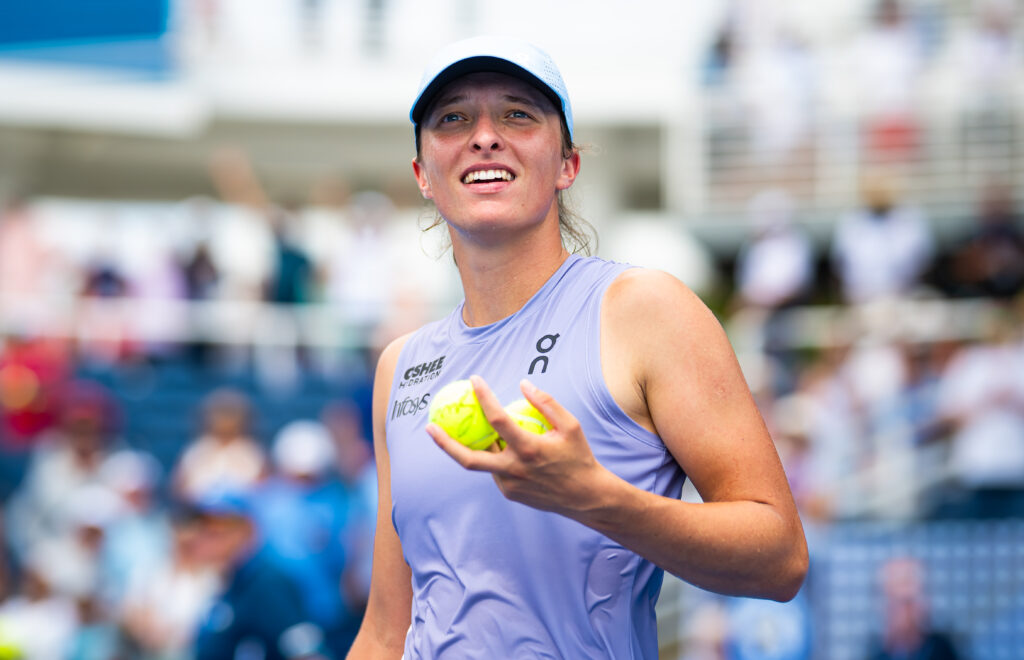 Iga Swiatek of Poland celebrates defeating Sorana Cirstea of Romania in the fourth round on Day 7 of the Cincinnati Open at Lindner Family Tennis Center.