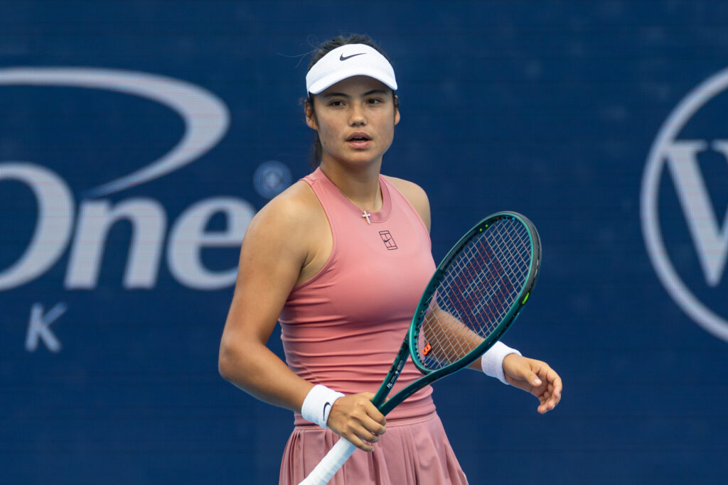 Emma Raducanu of Great Britain in action against Aryna Sabalenka of Belarus in the third round of the women's singles at Cincinnati at the Lindner Family Tennis Center.