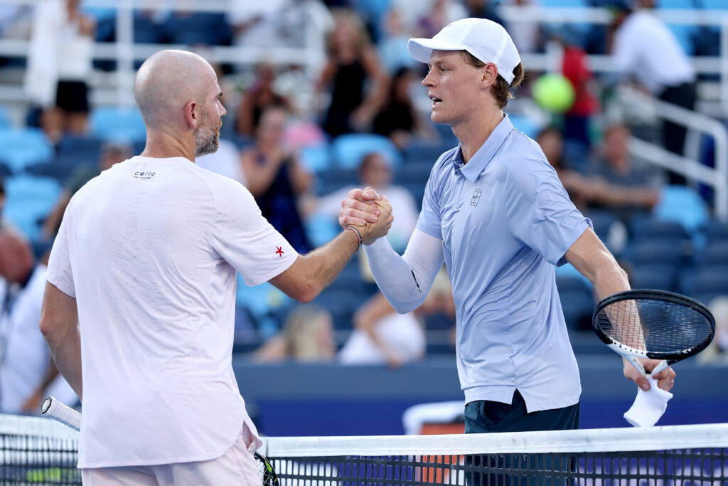 Jannik Sinner and Adrian Mannarino shake hands at the net after their Cincinnati Open 2025 match.