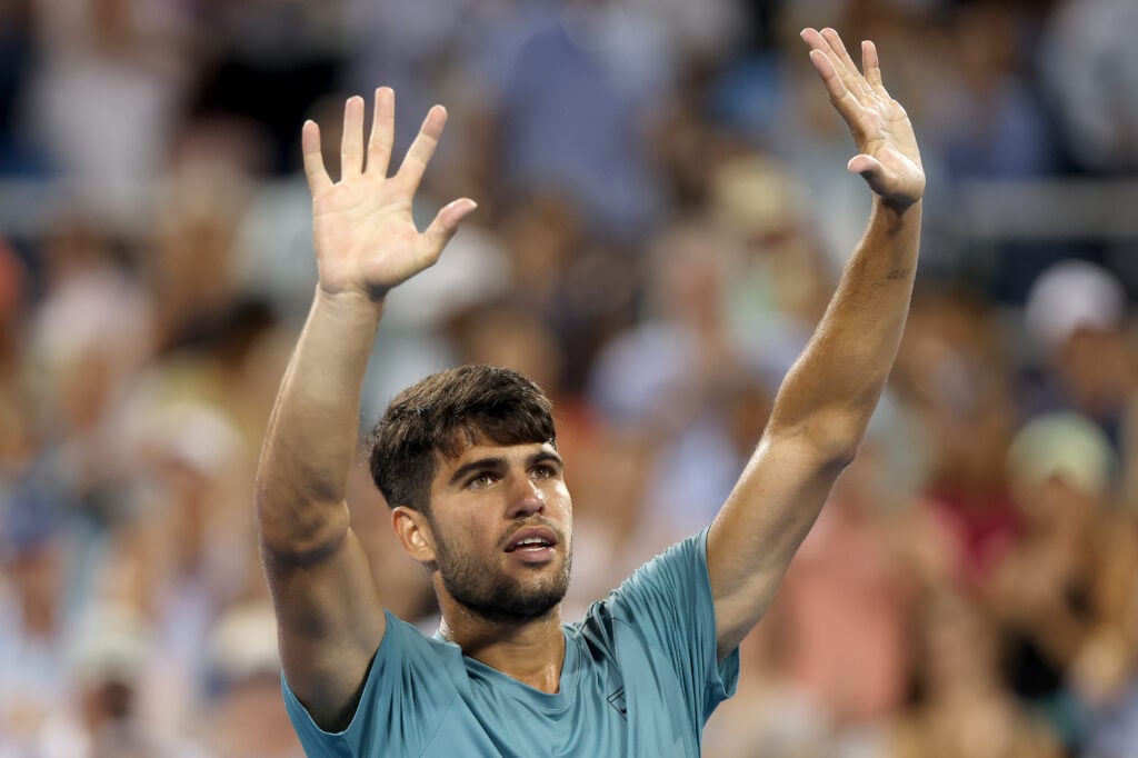 Carlos Alcaraz waves to the crowd after advancing to the quarterfinals at the Cincinnati Open.