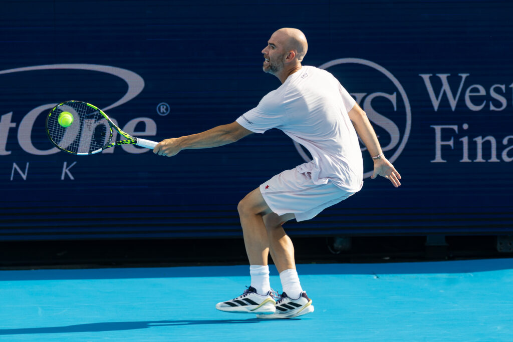 Adrian Mannarino hits a backhand against Jannik Sinner at the Cincinnati Open 2025 - Day 7