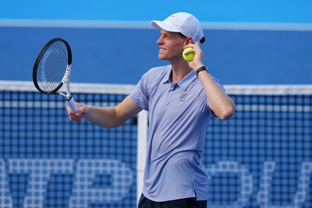 Jannik Sinner of Italy hits autographed tennis balls to the crowd after beating Térence Atmane of France 7-6, 6-2 during Day 10 of the Cincinnati Open at the Lindner Family Tennis Center.