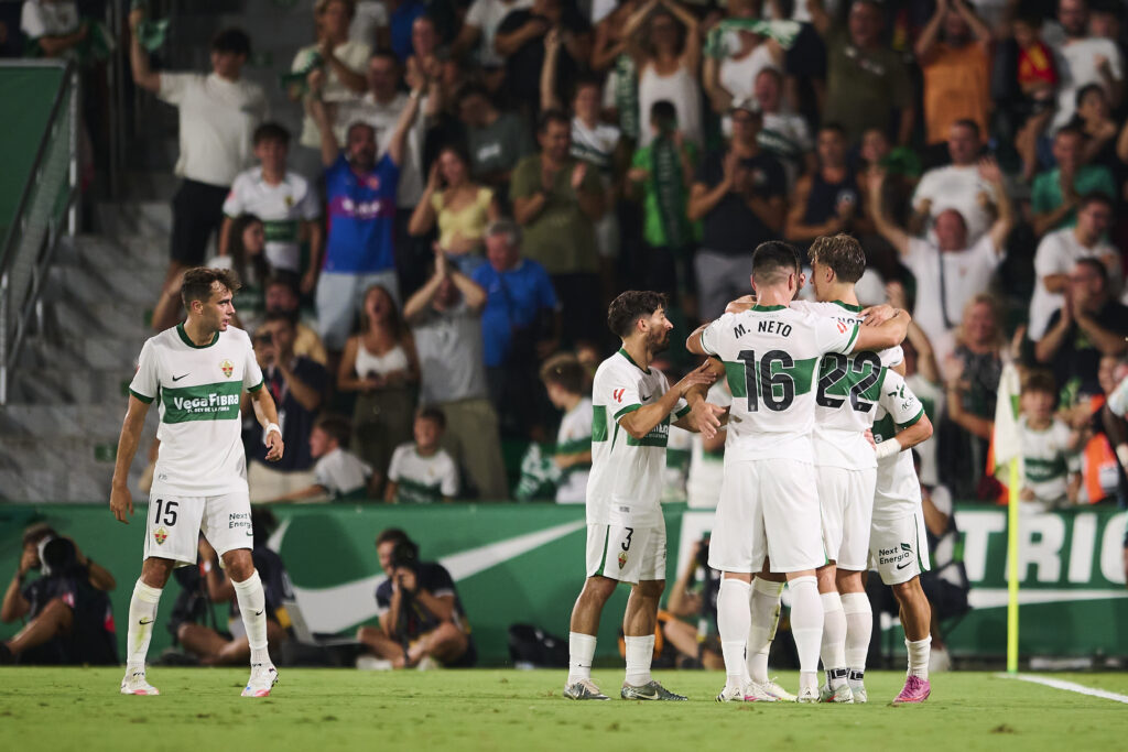 Elche players celebrate after scoring against Real Betis in La Liga