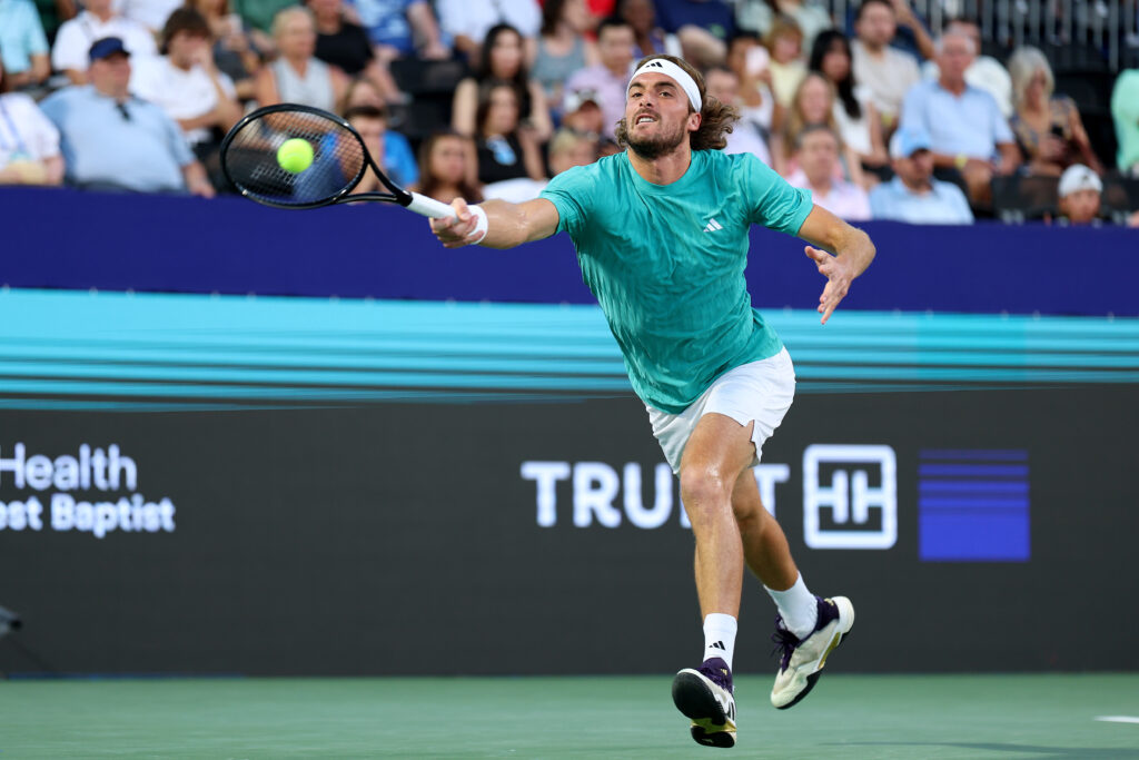 Stefanos Tsitsipas of Greece returns a shot in his match against Yunchaokete Bu of China during Day 2 of the ATP 250 Winston-Salem Open at Wake Forest Tennis Complex.