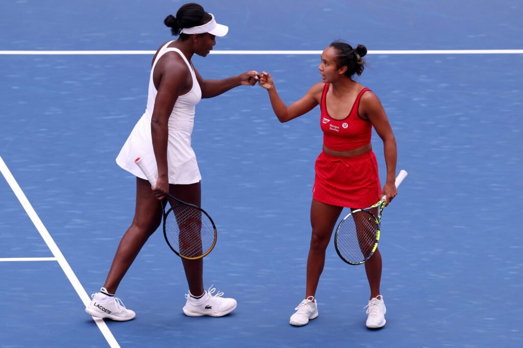 Venus Williams and Leylah Fernandez bump fists