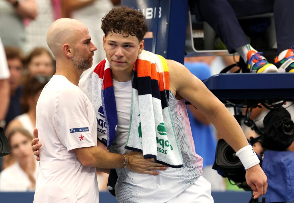 Adrian Mannarino of France and Ben Shelton of the United States embrace after Shelton retired at the end of the fourth set of their Men's Singles Third Round match on Day Six of the 2025 US Open at USTA Billie Jean King National Tennis Center.