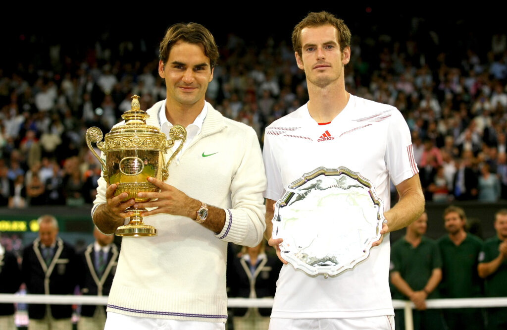 Roger Federer and Andy Murray with their trophies after the 2012 Wimbledon final.