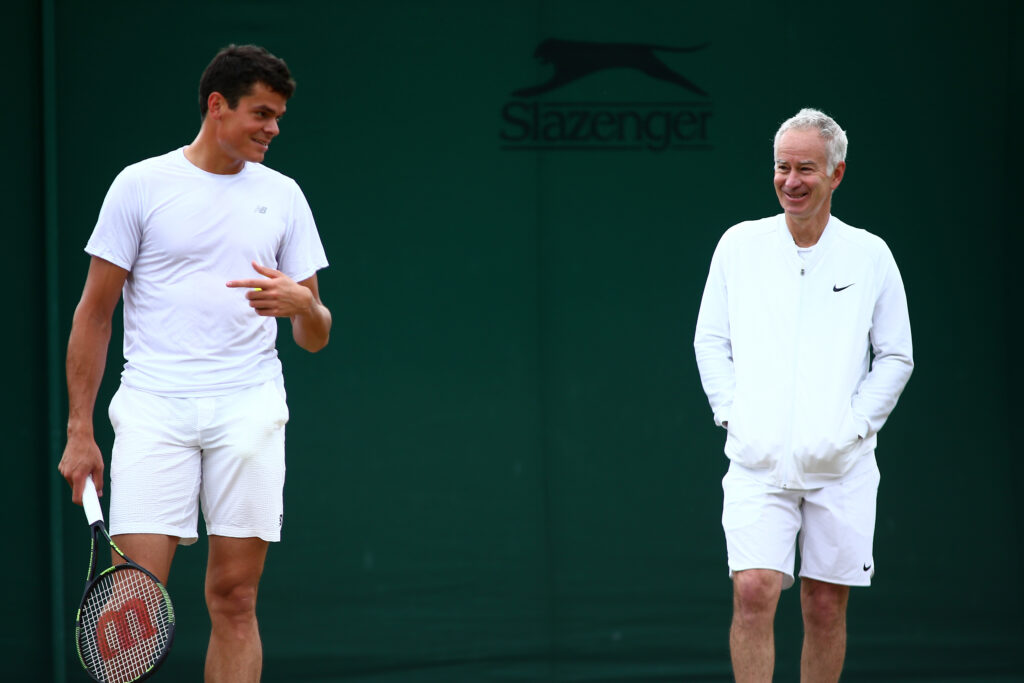 John McEnroe and Milos Raonic working together at Wimbledon in 2016.