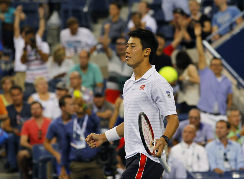 Kei Nishikori celebrates his win over Stan Wawrinka at the 2014 US Open