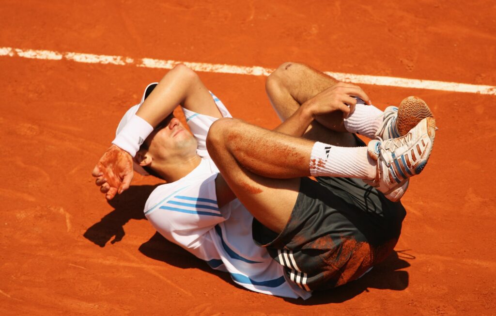 Novak Djokovic in pain at Roland Garros in 2006.