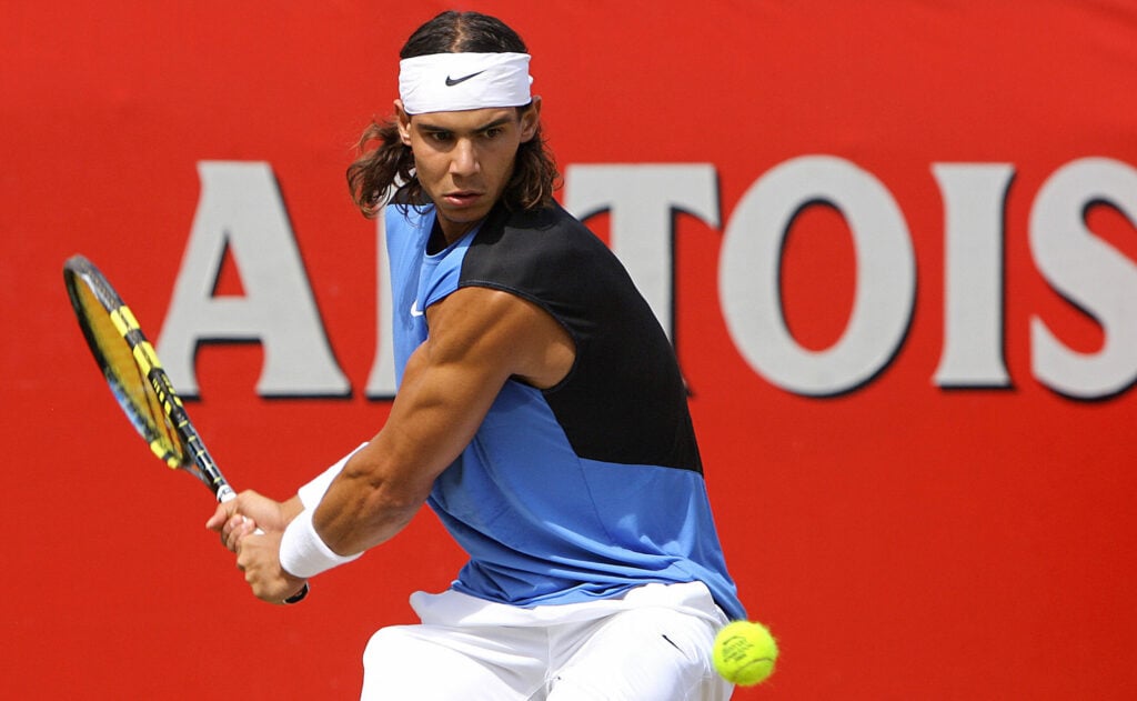 Rafael Nadal returns the ball at Queen's in 2006