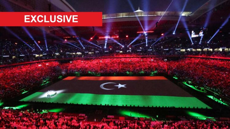 Image of the Libyan flag projected on the pitch during the opening ceremony of the FIFA Arab Cup 2021