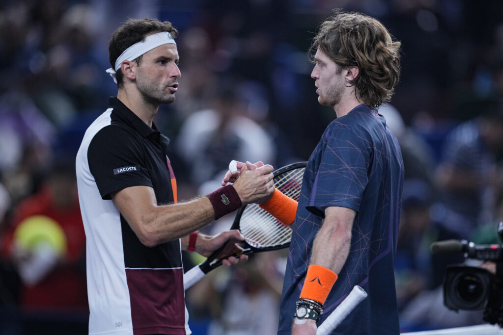 Grigor Dimitrov and Andrey Rublev shake hands after their match at the 2023 Shanghai Masters