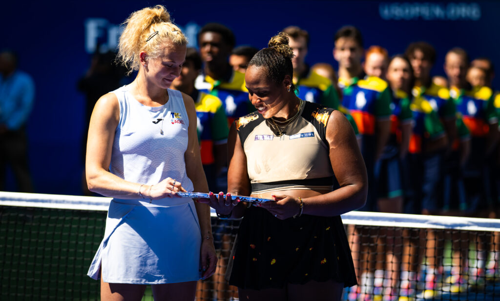 Taylor Fritz of the United States and Katerina Siniakova of the Czech Republic during the trophy ceremony after losing to Erin Routliffe of New Zealand and Gabriela Dabrowski of Canada in the womens doubles final on Day 13 of the US Open at USTA Billie Jean King National Tennis Center.