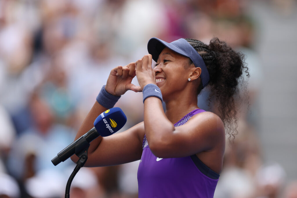 Naomi Osaka reacts during her on-court interview at the US Open.