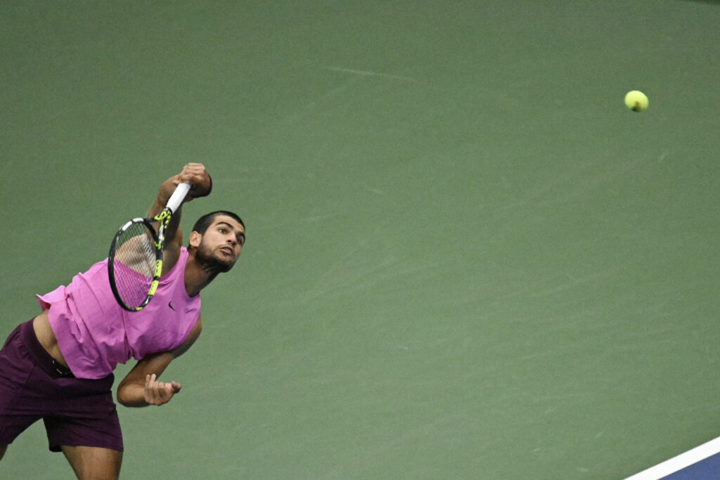 Carlos Alcaraz serves against Jannik Sinner in the 2025 US Open final