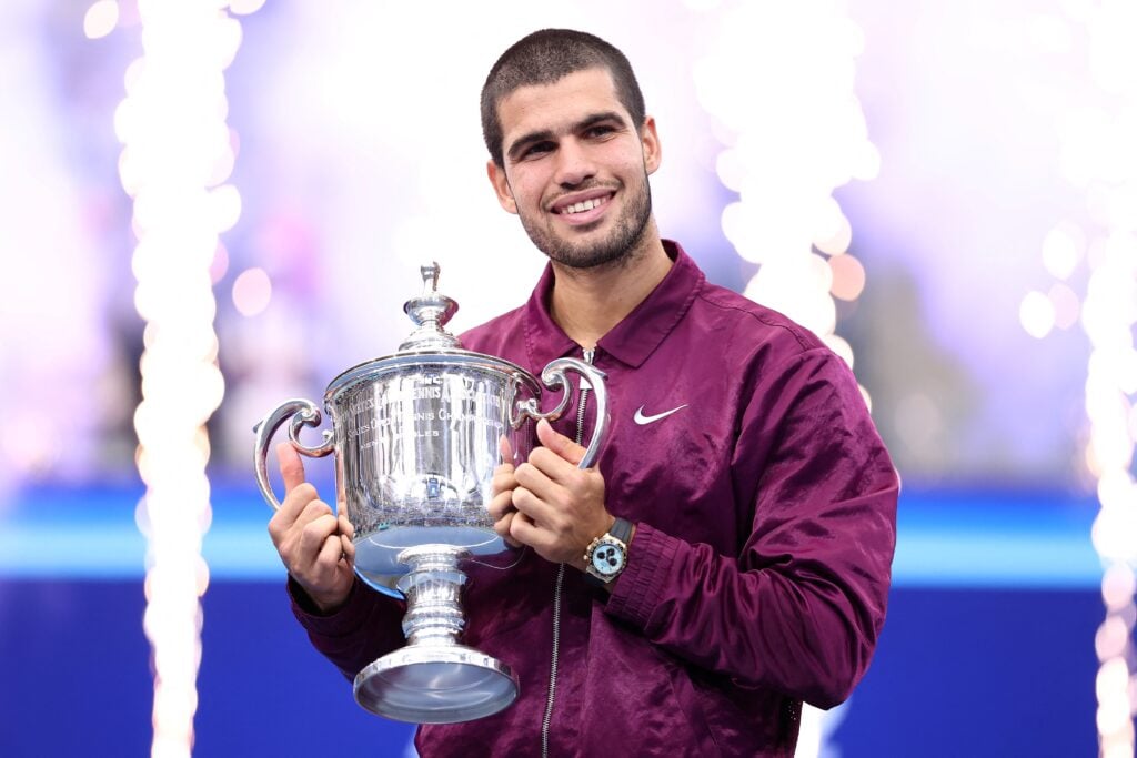 Carlos Alcaraz poses with his trophy after winning the men's singles final tennis match against Italy's Jannik Sinner on day fifteen of the US Open tennis tournament at the USTA Billie Jean King National Tennis Center.