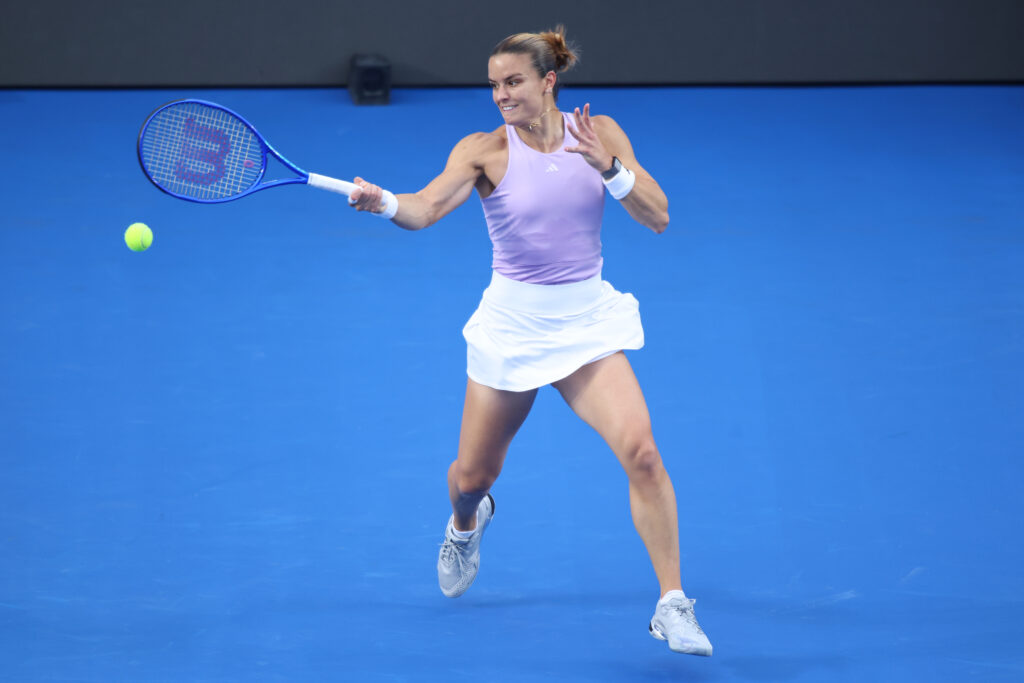 Maria Sakkari of Greece plays a forehand against Elsa Jacquemot of France during day 2 of the WTA 500 Guadalajara Open Akron at Mouratoglou Tennis Center.