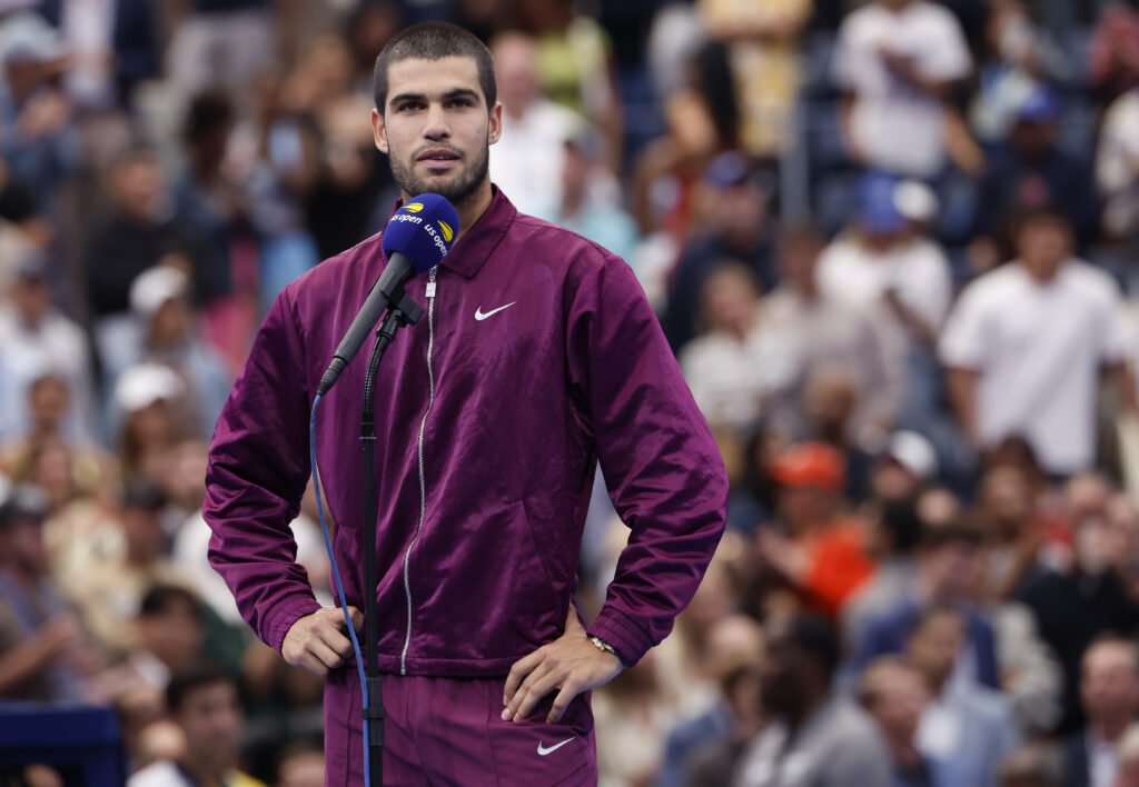 Carlos Alcaraz of Spain during the podium ceremony after defeating Jannik Sinner of Italy in the Men's Singles Final match on day fifteen of the 2025 US Open Tennis Championships at USTA Billie Jean King National Tennis Center.