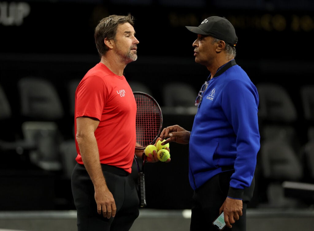 Patrick Rafter talks with Yannick Noah at the Laver Cup.