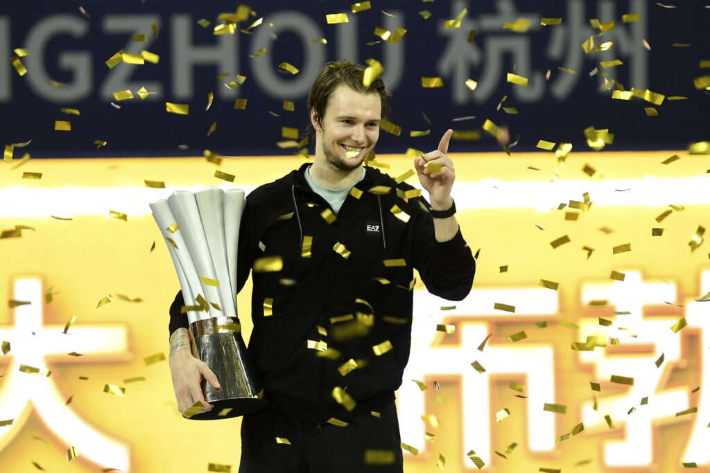 Alexander Bublik celebrates with the title after winning the 2025 Hangzhou Open