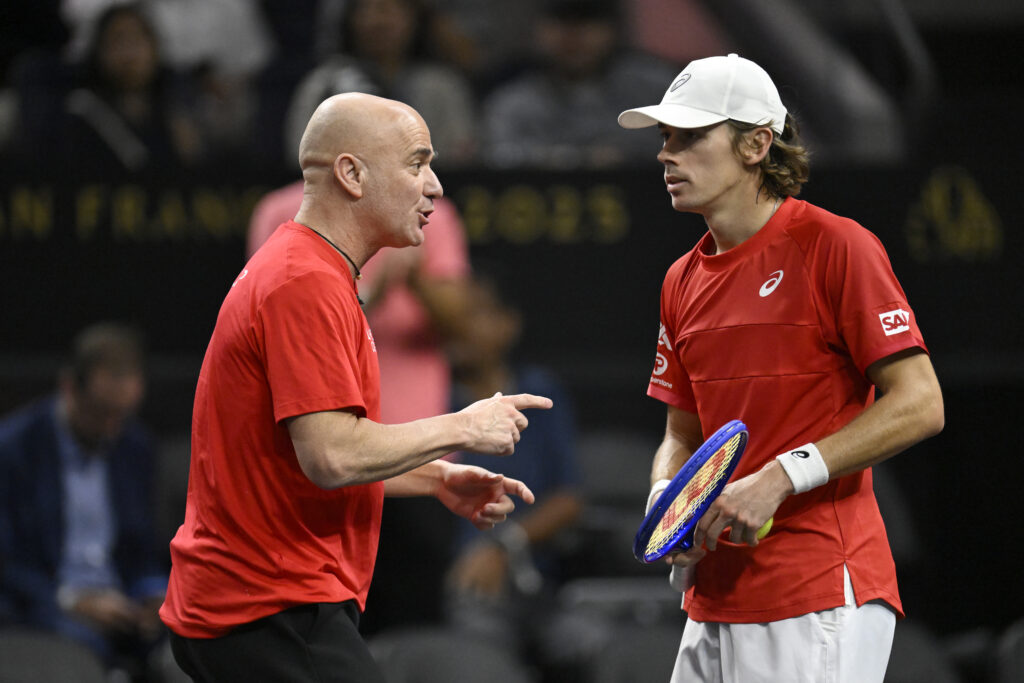 Team World Captain Andre Agassi talks with Alex De Minaur of Team World in his match against Alexander Zverev of Team Europe during day two of Laver Cup 2025 at Chase Center.