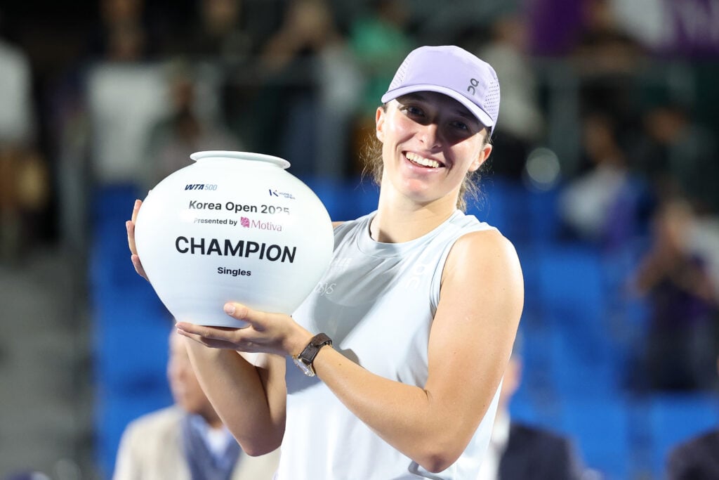 Iga Swiatek of Poland poses with the trophy following victory in the Women's Singles Final match on Day Seven of the Korea Open Tennis Championship 2025 presented by Motiva at Seoul Olympic Park Tennis Center.