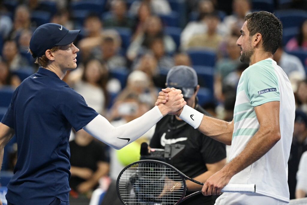 Jannik Sinner and Marin Cilic shake hands at the net after their match at the 2025 China Open