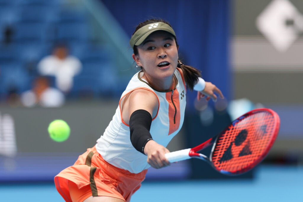 Lin Zhu of China returns a shot against Moyuka Uchijima of Japan in the Women's Singles First Round on day 4 of 2025 China Open at National Tennis Center.