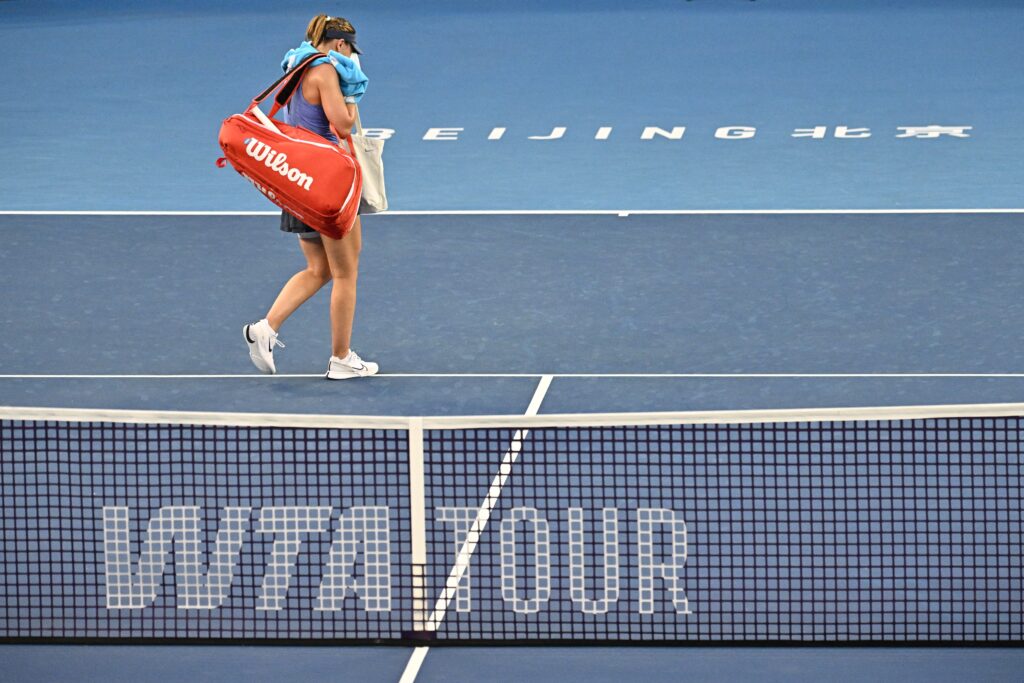 Paula Badosa reacts after retiring against Czech Republic's Karolina Muchova during their men's singles match at the China Open tennis tournament in Beijing.