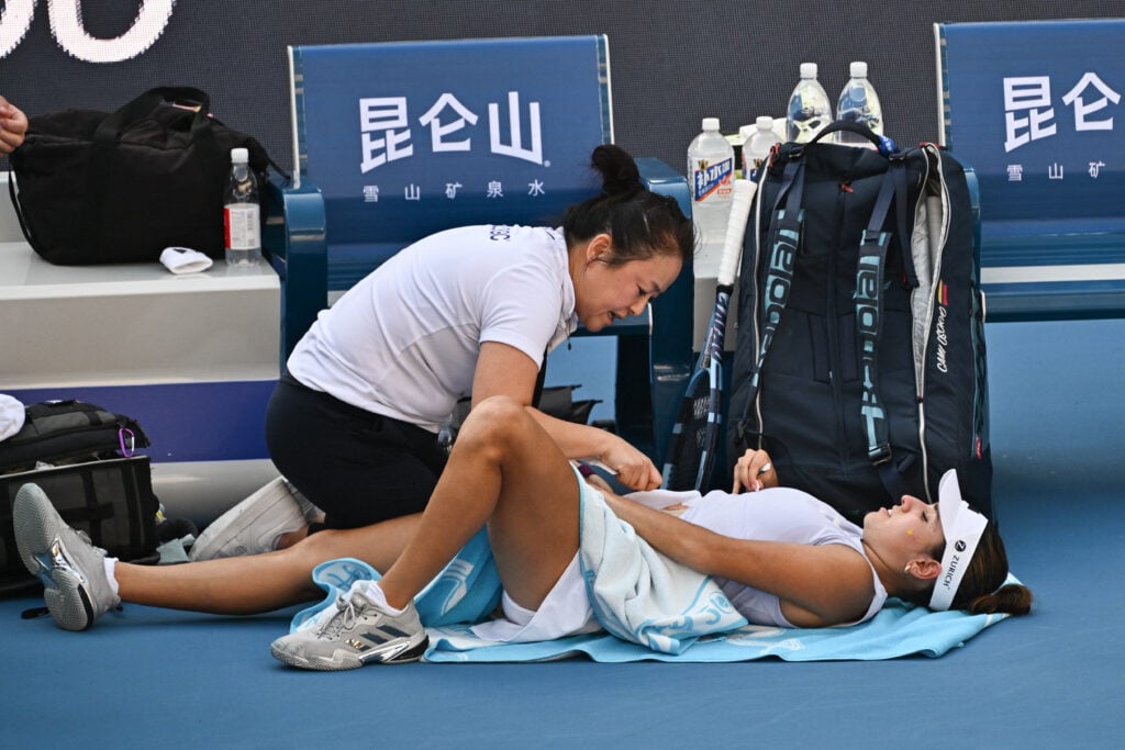 Camila Osorio receives medical treatment at the China Open.