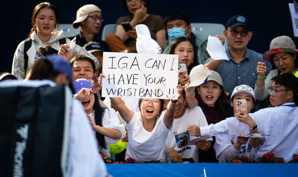 Fans cheer on Iga Swiatek of Poland during the third round on Day 8 of the China Open at National Tennis Center.