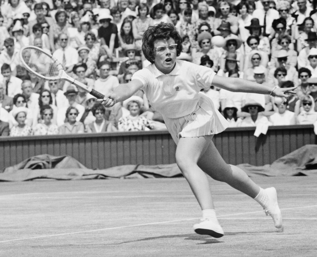 Billie Jean King in action at Wimbledon in 1964