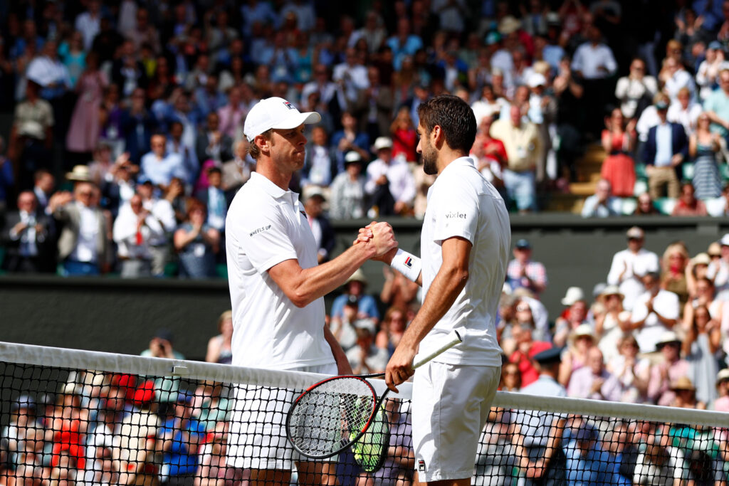 Sam Querrey and Marin Cilic shake hands at the net after their 2017 Wimbledon semifinal