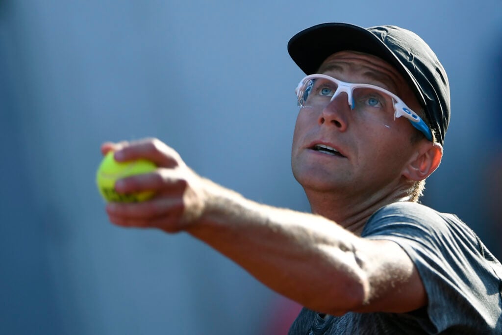 Peter Polansky serves during his first-round match at the 2018 French Open