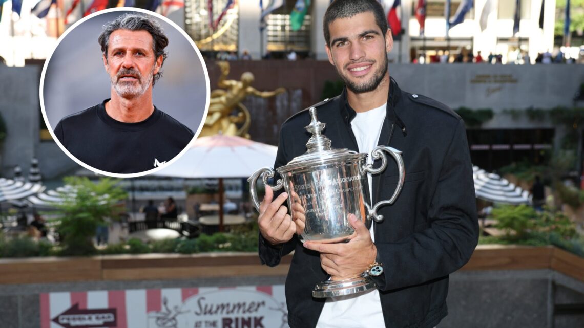 Carlos Alcaraz of Spain poses for a photo overlooking Rockefeller Plaza with the Men's Singles trophy following his victory over Jannik Sinner of I...