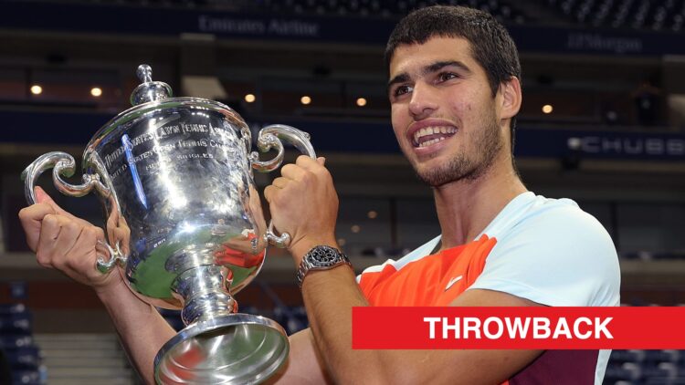 Carlos Alcaraz lifts the US Open trophy in 2022, throwback label added