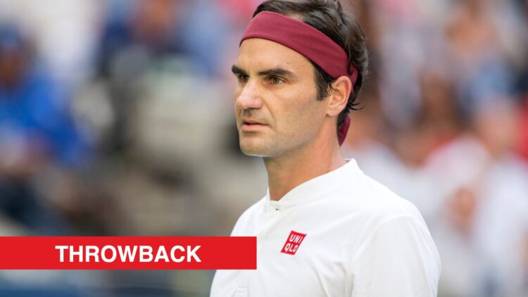 Roger Federer looking on at the US Open in 2018, with a throwback label.