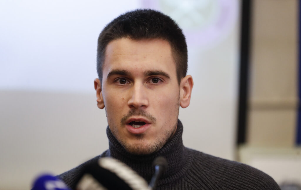 Djordje Djokovic speaks during a press conference in 2022
