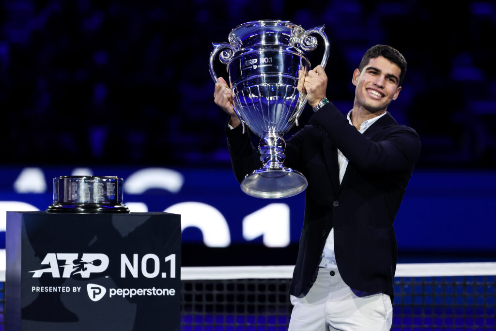 Carlos Alcaraz of Spain holds the ATP World Tour No. 1 trophy during day four of the Nitto ATP Finals at Pala Alpitour.
